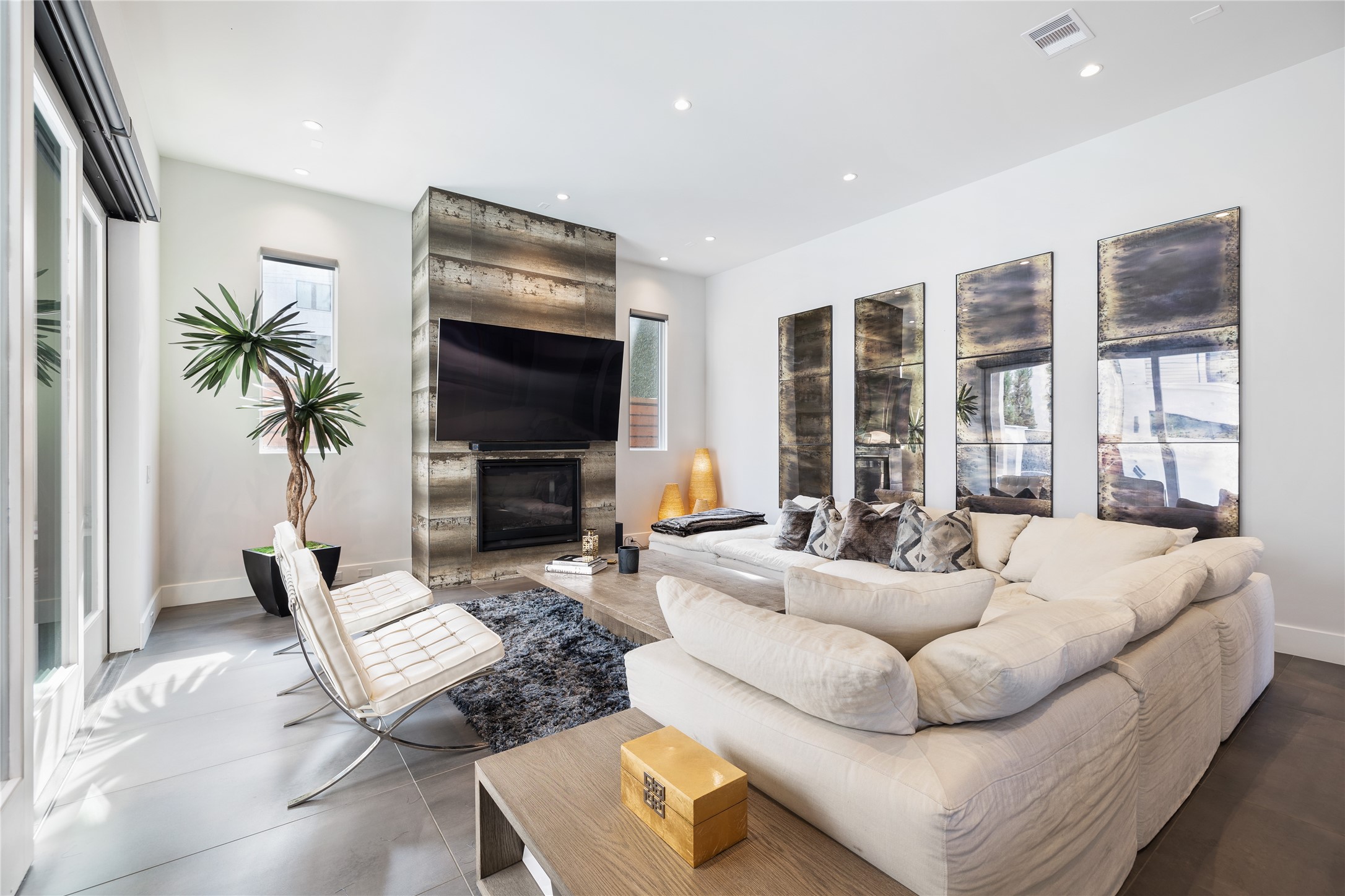 103 Roy Street Houston, TX 77007 - Photo 7 of 37 a living room with fireplace furniture and a flat screen tv
