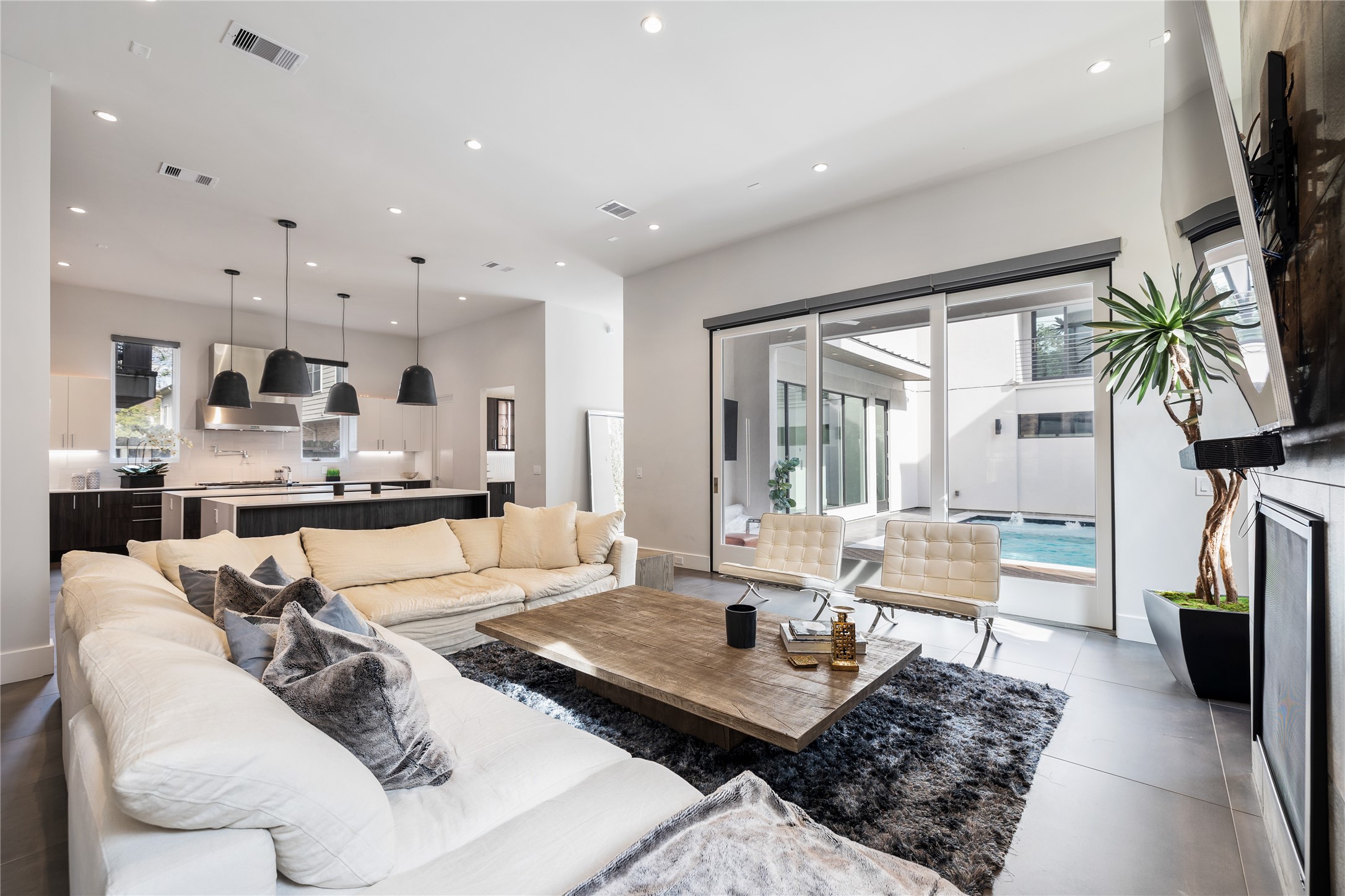 103 Roy Street Houston, TX 77007 - Photo 8 of 37 a living room with furniture kitchen view and a large window