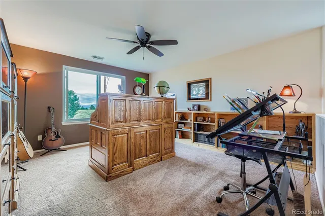 a living room with furniture a air conditioner vent and a window