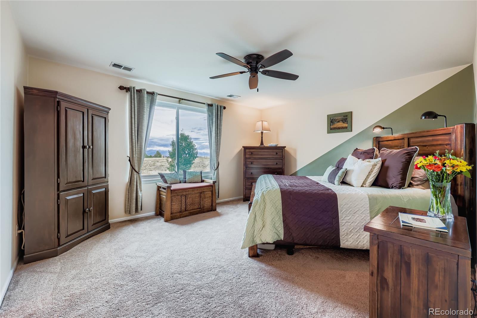 1005 Parsons Avenue Castle Rock, CO 80104 - Photo 15 of 38 a bedroom with furniture and a window