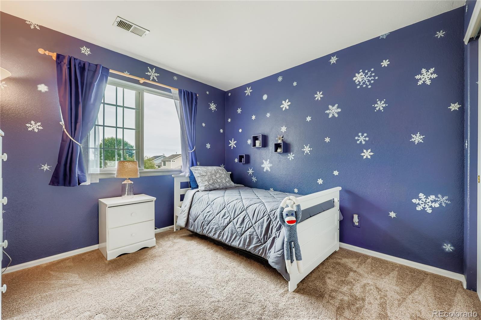 1005 Parsons Avenue Castle Rock, CO 80104 - Photo 20 of 38 a bedroom with a bed and window