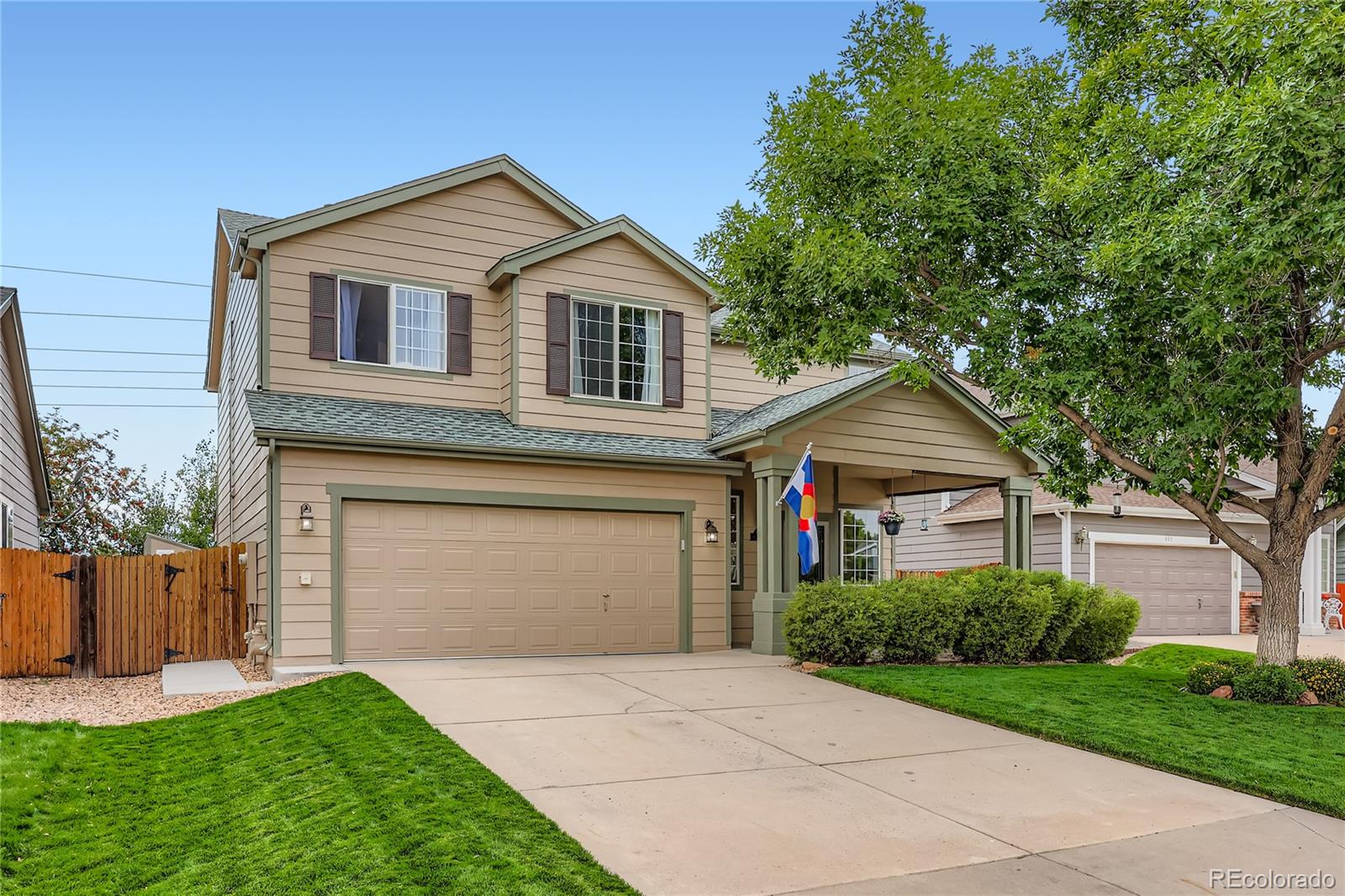 1005 Parsons Avenue Castle Rock, CO 80104 - Photo 2 of 38 a front view of a house with a yard and garage