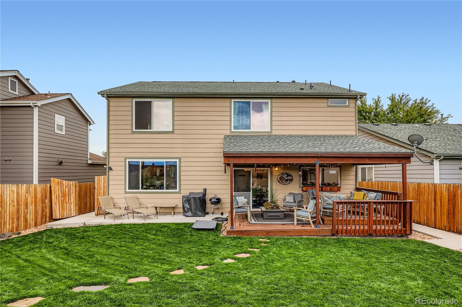 1005 Parsons Avenue Castle Rock, CO 80104 - Photo 25 of 38 a view of a house with a backyard and a patio