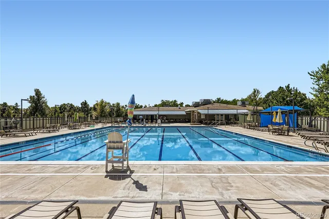 a view of a swimming pool with seating area