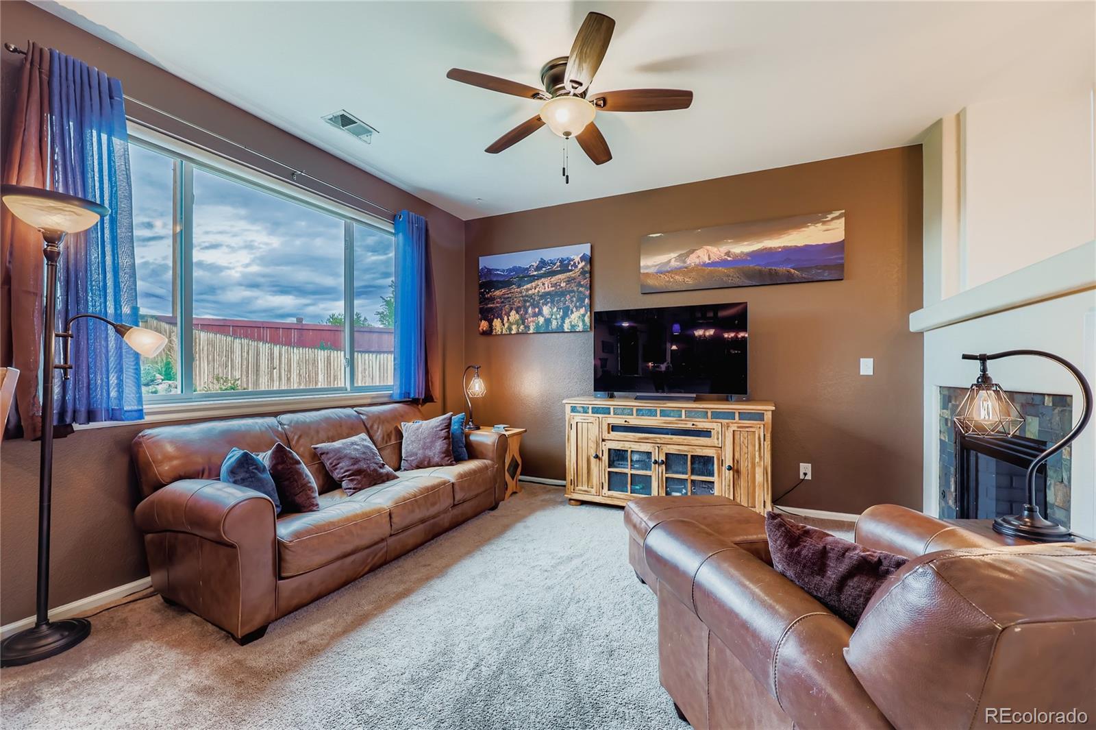 1005 Parsons Avenue Castle Rock, CO 80104 - Photo 6 of 38 a living room with furniture and a flat screen tv