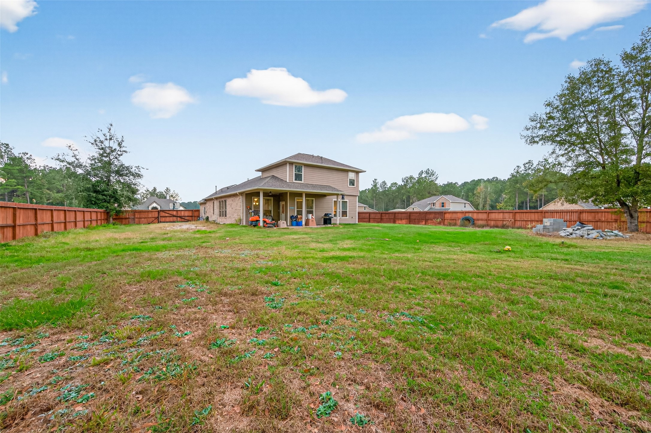 16601 Crosby Street Conroe, TX 77303 - Photo 41 of 50 Expansive backyard with full privacy fencing and plenty of open space—ideal for outdoor activities, gardening, or future customization.