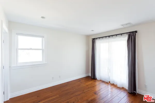 wooden floor with white walls