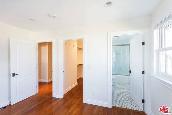 a bathroom with a sink a mirror and a shower