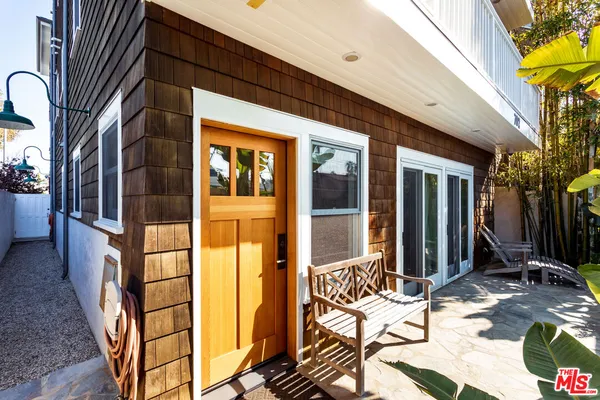 a view of a chairs and table in the patio