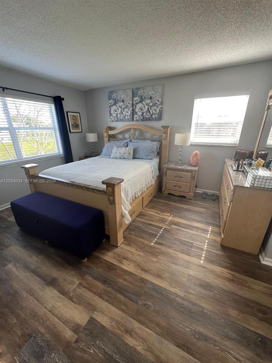 9880 Marina Boulevard, Unit 1516 Boca Raton, FL 33428 - Photo 11 of 32 a bedroom with a bed and window