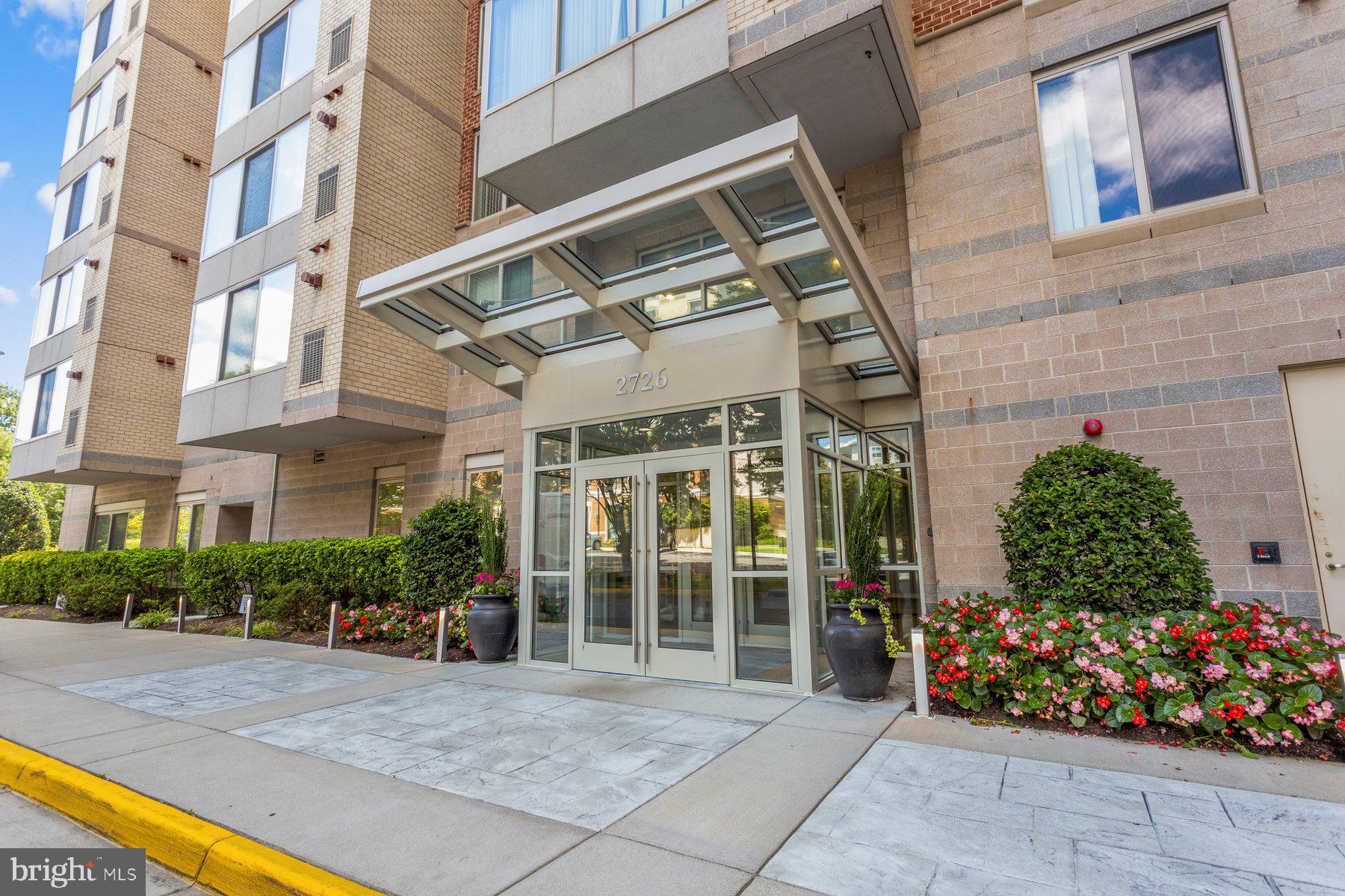 2726 Gallows Road, Unit 101 Vienna, VA 22180 - Photo 21 of 25 Modern entrance with vibrant landscaping.