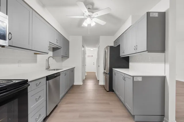 a view of a bathroom from a hallway