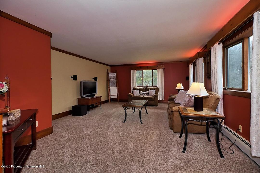210 Forba Road Factoryville, PA 18419 - Photo 3 of 47 a living room with furniture a window and a flat screen tv