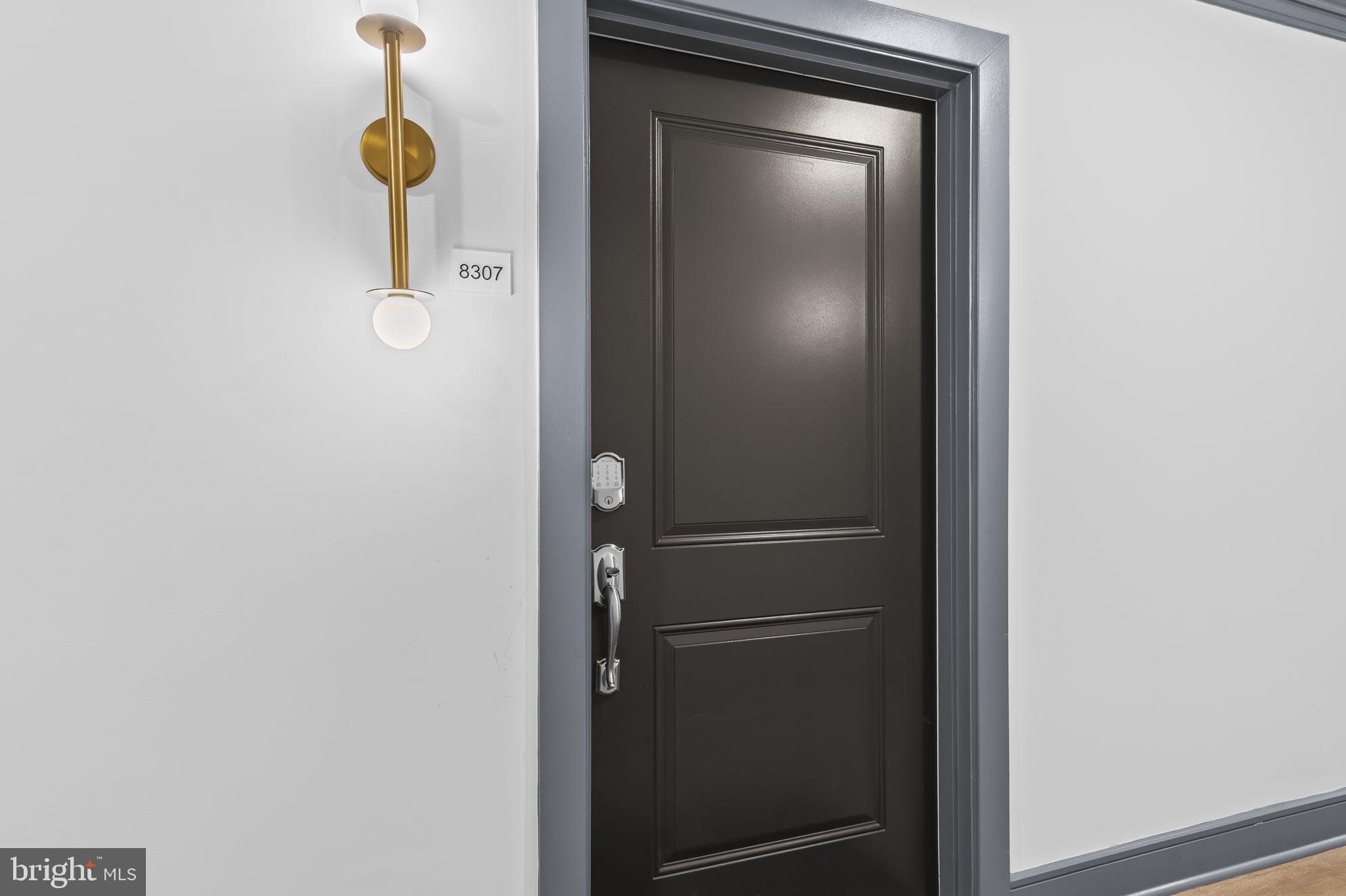 4007 Seaside Alder Road, Unit 8307 Bowie, MD 20720 - Photo 3 of 32 a bathroom with a shower and mirror