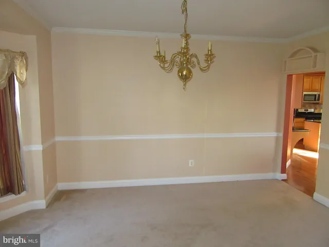 a view of a livingroom with a fireplace and window