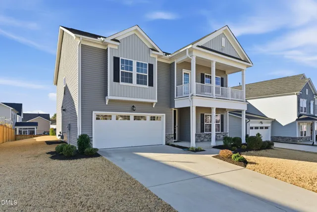 a front view of a house with yard
