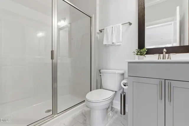 an aerial view of a house with a swimming pool