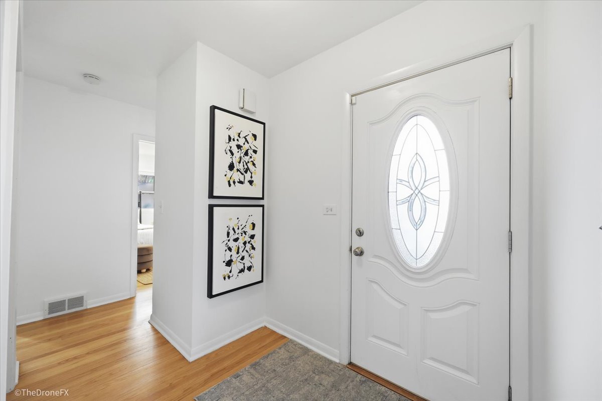 1519 Foothill Drive Wheaton, IL 60189 - Photo 8 of 44 a view of a hallway with wooden floor
