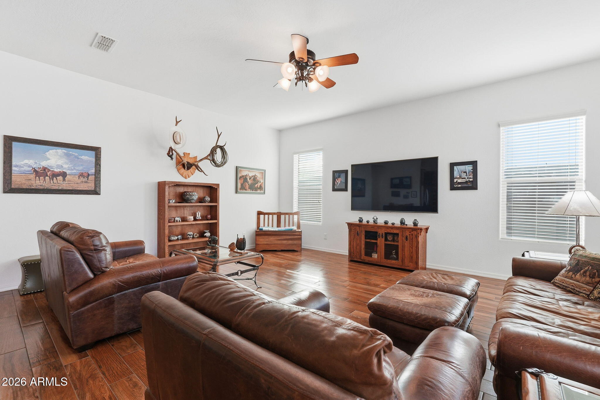 20066 East Russet Road Queen Creek, AZ 85142 - Photo 12 of 59 a living room with furniture a ceiling fan and a window