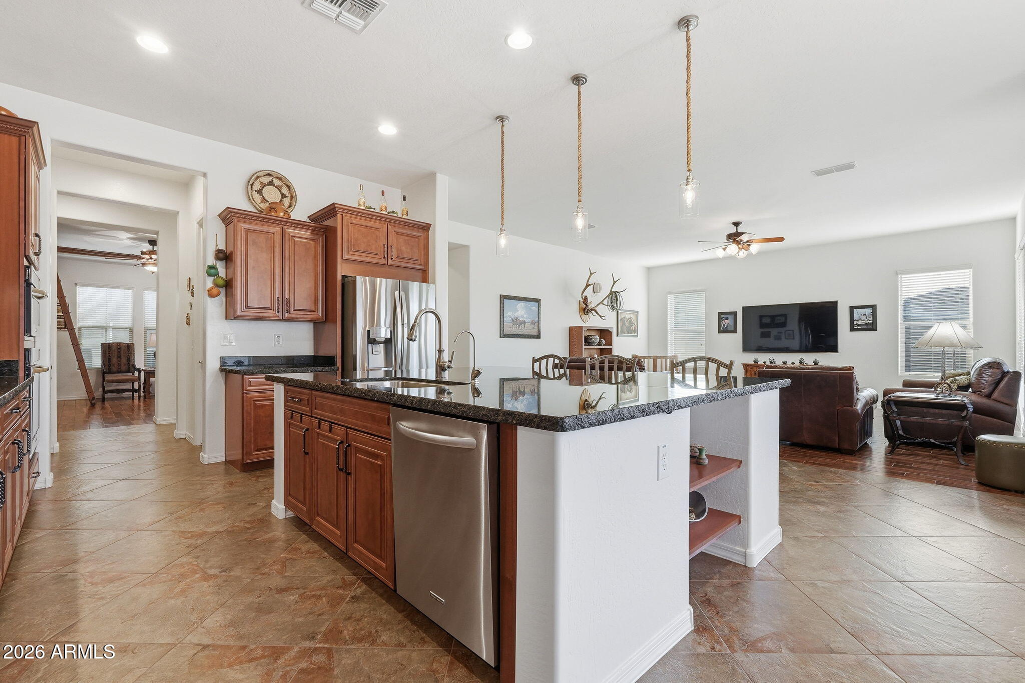 20066 East Russet Road Queen Creek, AZ 85142 - Photo 16 of 59 a kitchen with stainless steel appliances kitchen island granite countertop a sink and cabinets