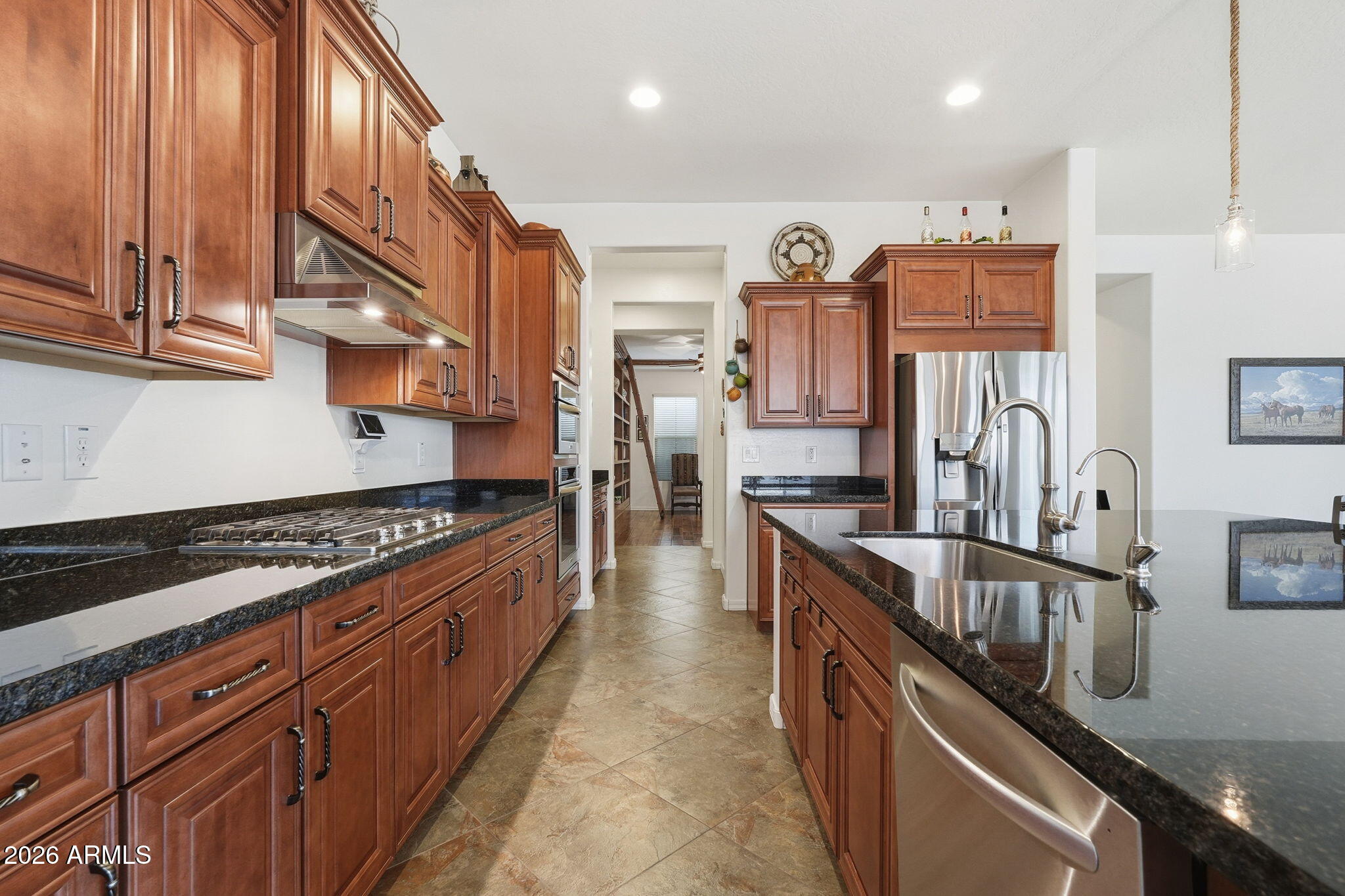 20066 East Russet Road Queen Creek, AZ 85142 - Photo 17 of 59 a kitchen with stainless steel appliances granite countertop lots of counter top space a stove top oven