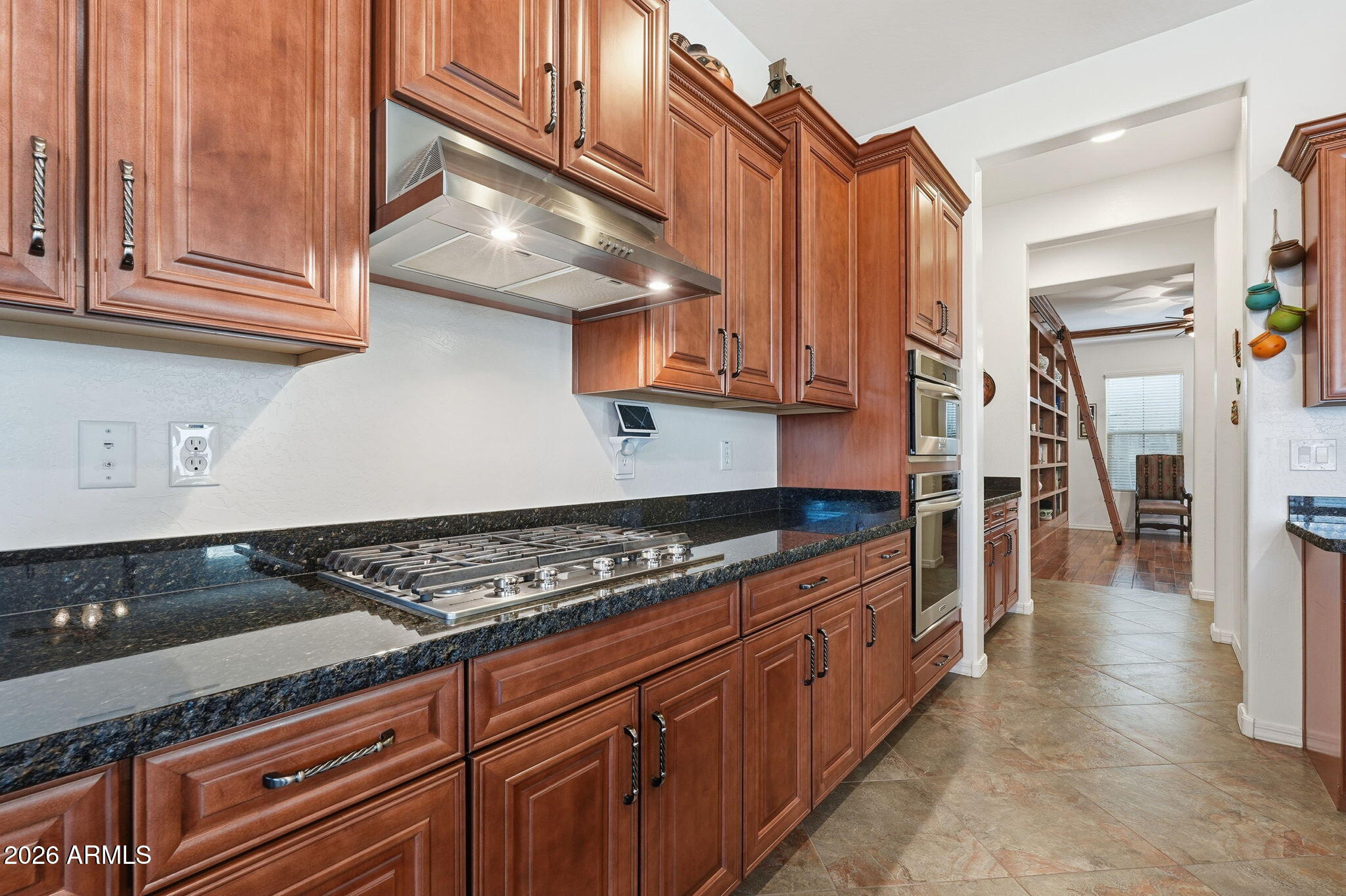 20066 East Russet Road Queen Creek, AZ 85142 - Photo 18 of 59 a kitchen with granite countertop a stove and cabinets