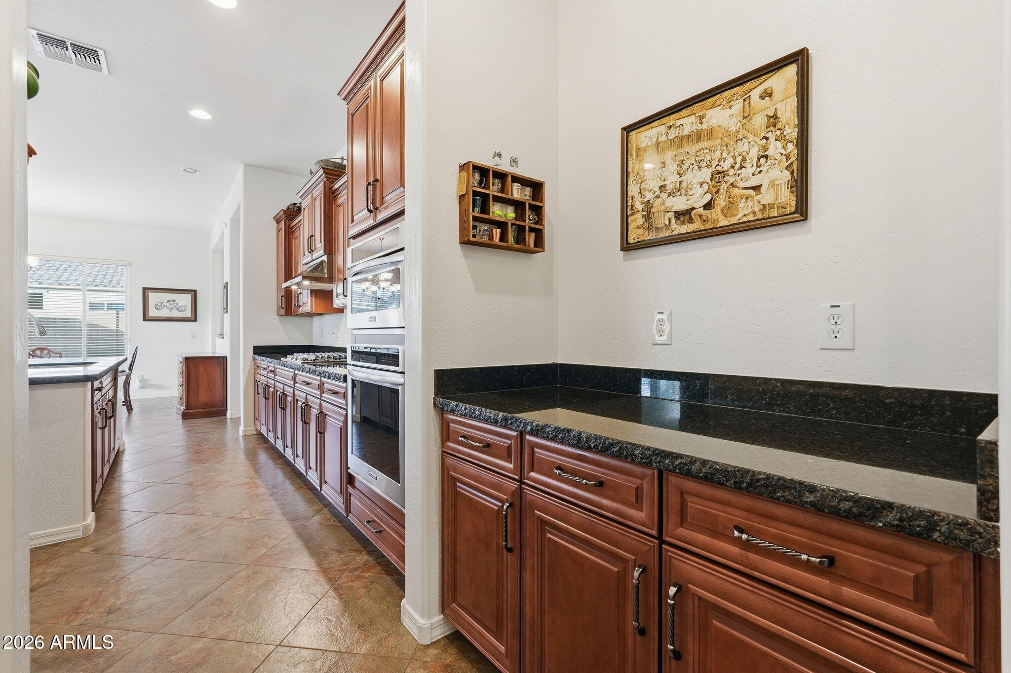20066 East Russet Road Queen Creek, AZ 85142 - Photo 23 of 59 a kitchen with stainless steel appliances granite countertop a stove and a cabinets