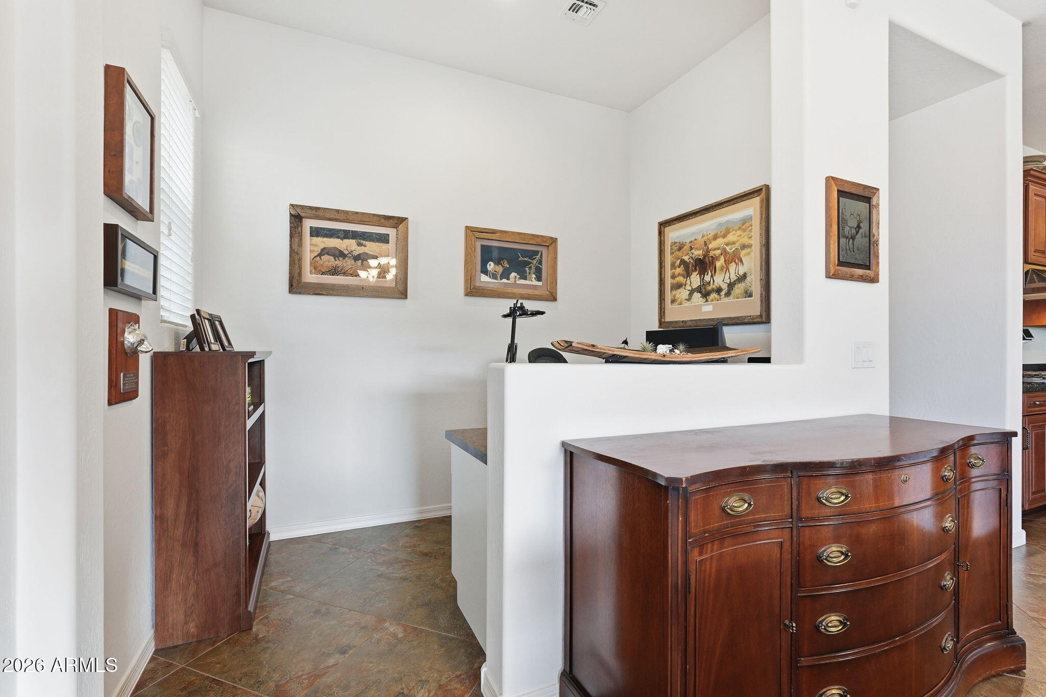 20066 East Russet Road Queen Creek, AZ 85142 - Photo 29 of 59 a view of a hallway with painting on the wall