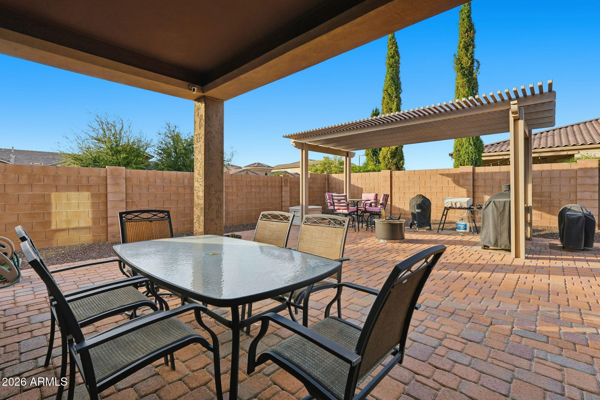 20066 East Russet Road Queen Creek, AZ 85142 - Photo 49 of 59 a view of a patio with a table and chairs