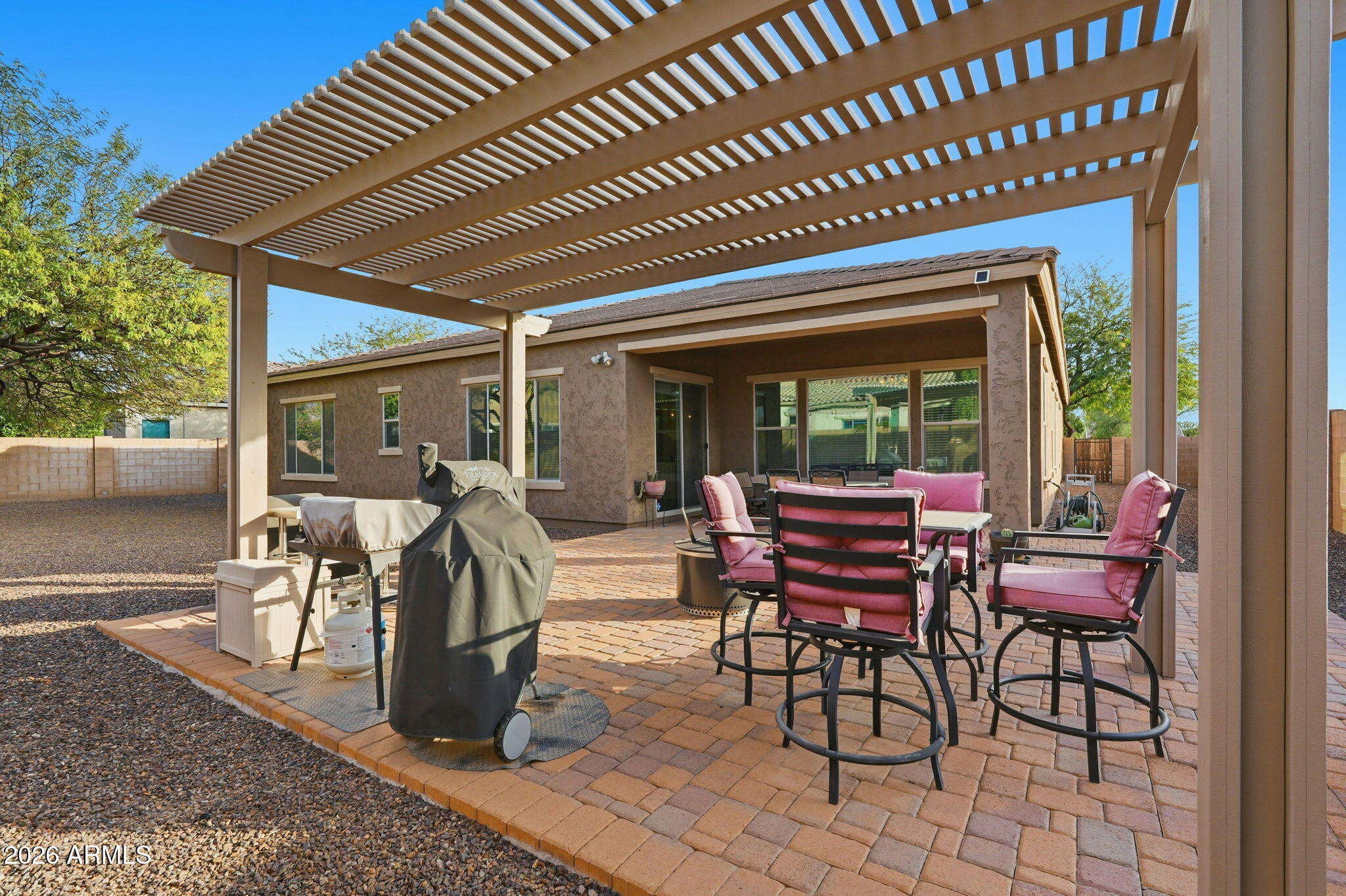 20066 East Russet Road Queen Creek, AZ 85142 - Photo 53 of 59 a view of a patio with a table chairs and a patio