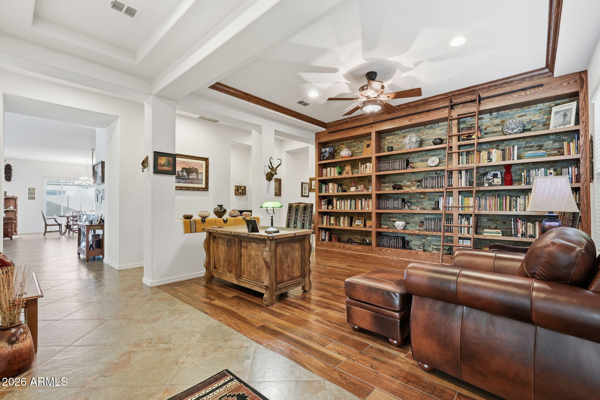 20066 East Russet Road Queen Creek, AZ 85142 - Photo 8 of 59 a livingroom with furniture and a book shelf