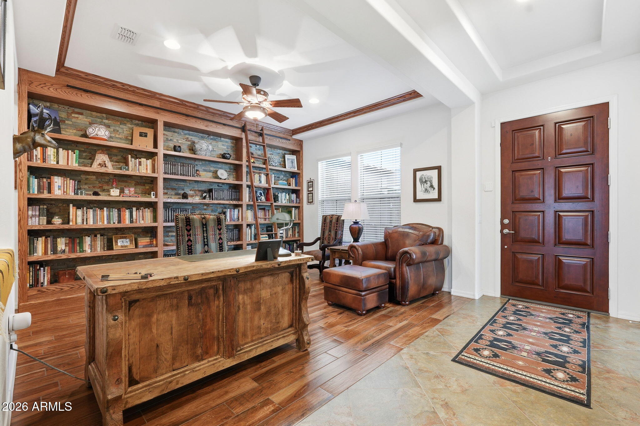 20066 East Russet Road Queen Creek, AZ 85142 - Photo 9 of 59 a living room with furniture and a book shelf