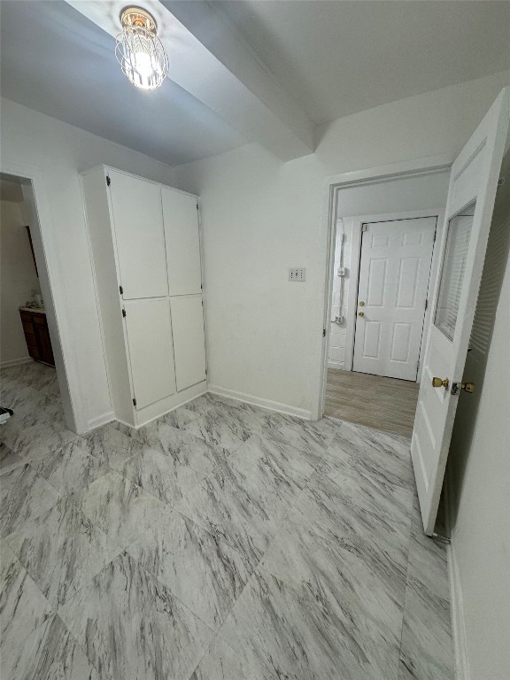 3405 Cherrywood Road Austin, TX 78722 - Photo 11 of 17 Unfurnished bedroom with baseboards and ensuite bathroom