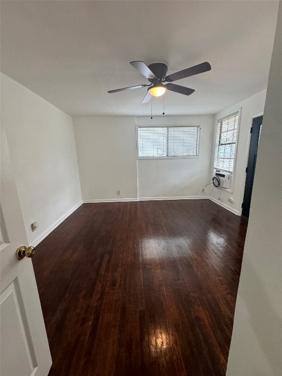 3405 Cherrywood Road Austin, TX 78722 - Photo 12 of 17 Unfurnished room featuring dark wood-type flooring and ceiling fan
