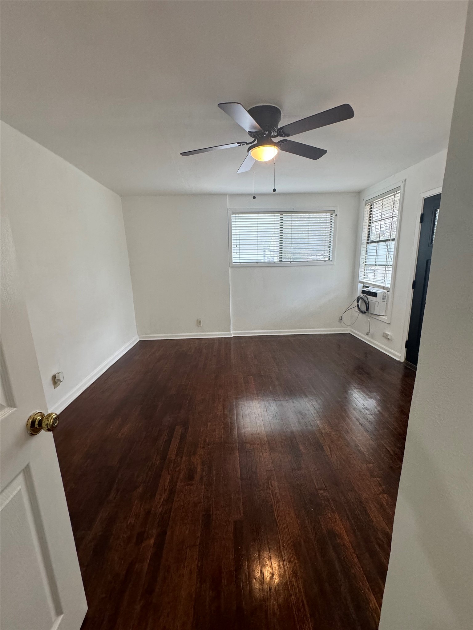 3405 Cherrywood Road Austin, TX 78722 - Photo 12 of 17 wooden floor in an empty room with a window