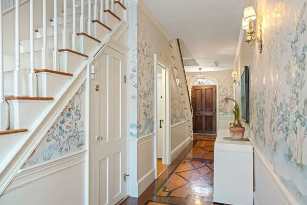 a bedroom with a bed and a fireplace