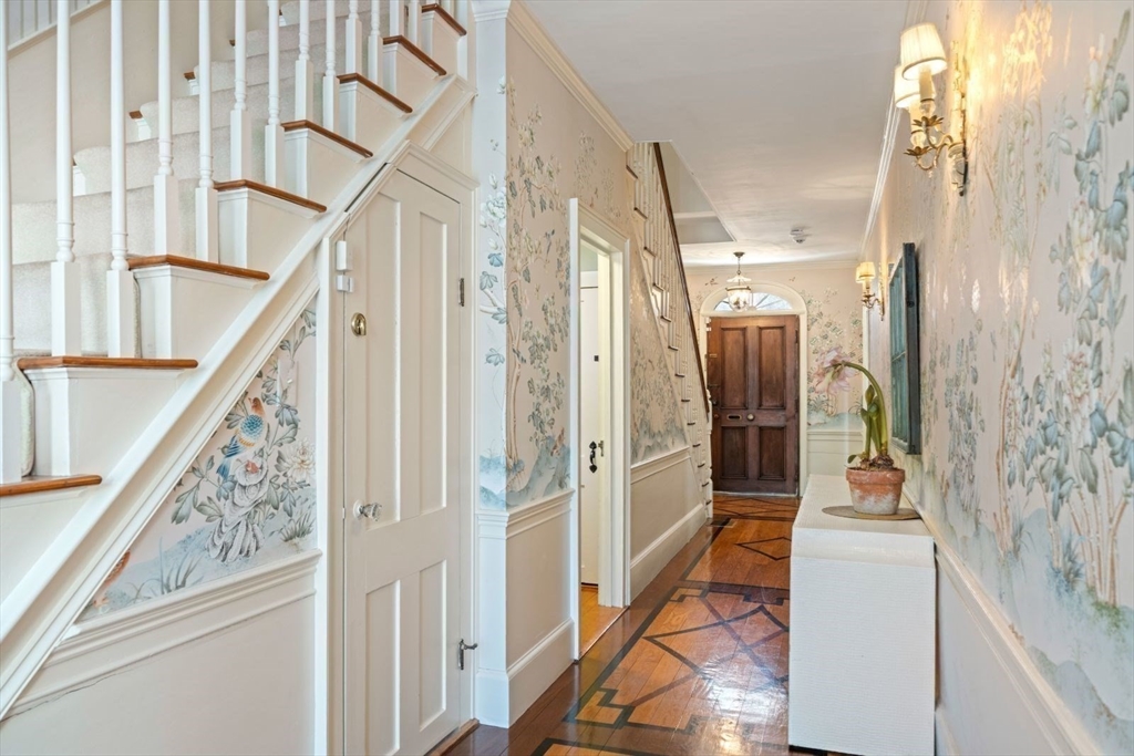 45 School Street Manchester, MA 01944 - Photo 17 of 42 a view of a hallway with wooden floor and staircase