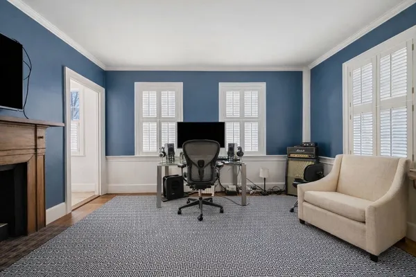 a bedroom with furniture and a window
