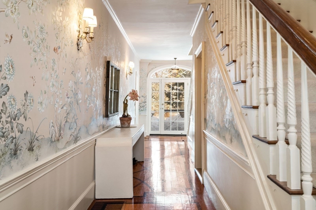 45 School Street Manchester, MA 01944 - Photo 38 of 42 a hallway with a large window and a wooden floor