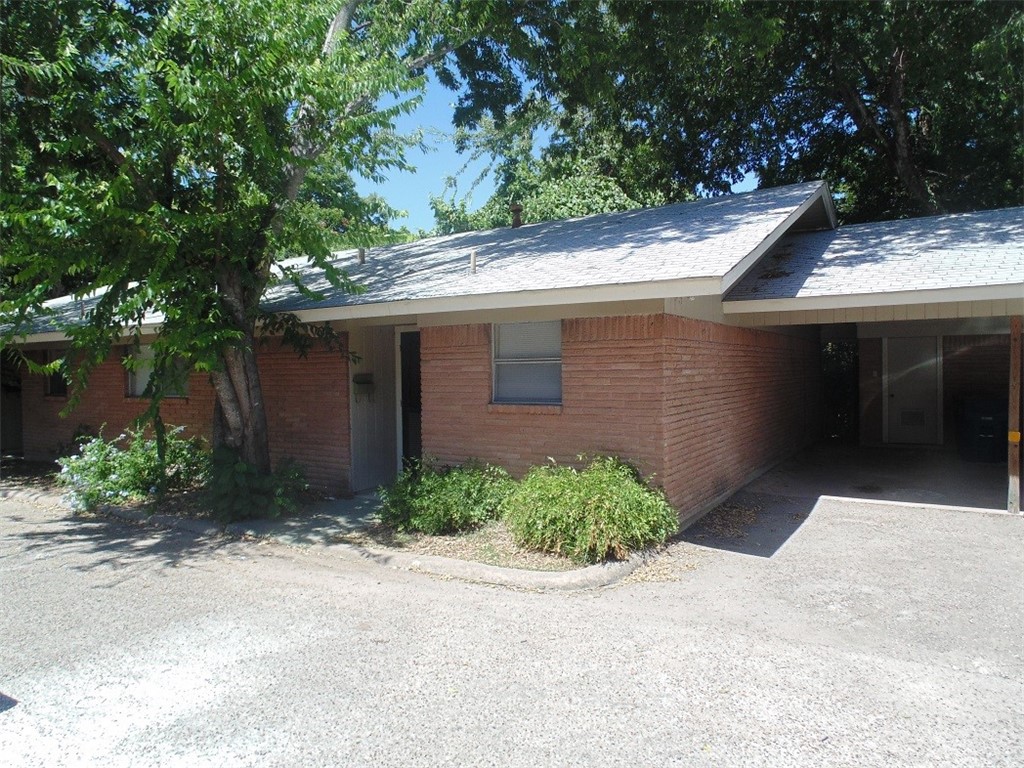 701 East 45th Street, Unit A Austin, TX 78751 - Photo 1 of 1 a backyard of a house with plants and trees