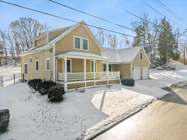 a front view of a house with a yard