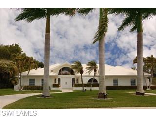 4356 Crayton Road Naples, FL 34103 - Photo 1 of 8 a view of open space in front of a house with a big yard
