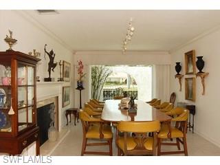 4356 Crayton Road Naples, FL 34103 - Photo 3 of 8 a view of a dining room with furniture and a large window
