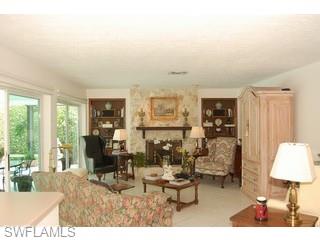 4356 Crayton Road Naples, FL 34103 - Photo 5 of 8 a living room with furniture