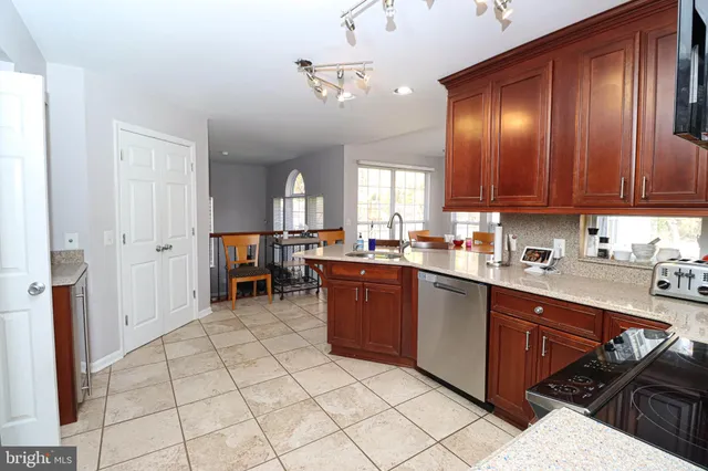 a view of a dining room with furniture large windows and wooden floor