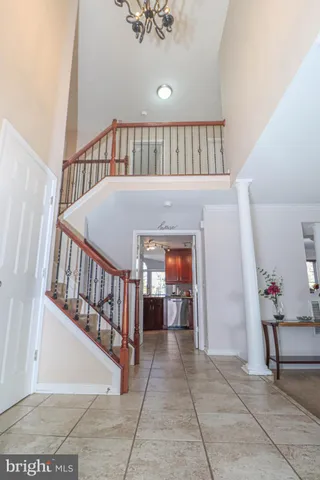 a spacious bathroom with a double vanity sink a mirror and a bathtub