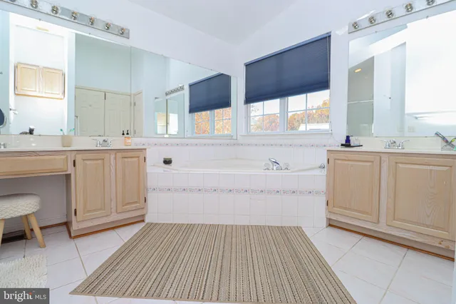 a view of walk in closet with clothes