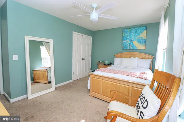 a bedroom with a bed and a cabinets