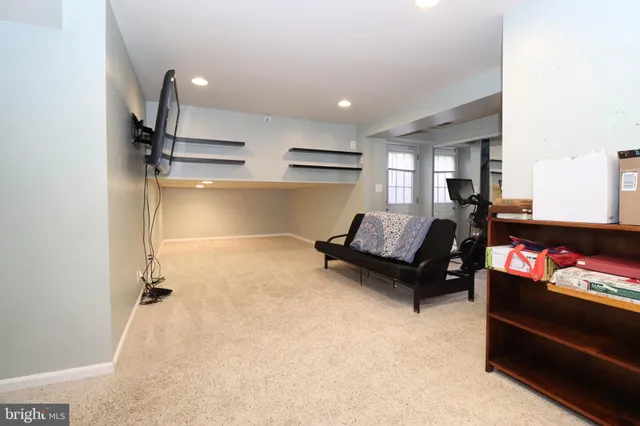 a view of a house with backyard and trees