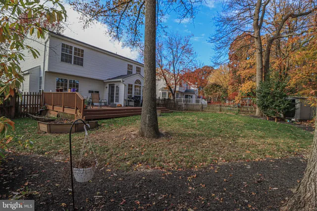 a view of a backyard with sitting area